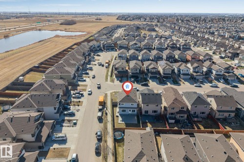 Residential neighborhood featuring a consistent architectural style and paved streets - 1103 29 Street, Edmonton, AB - Outdoor With View