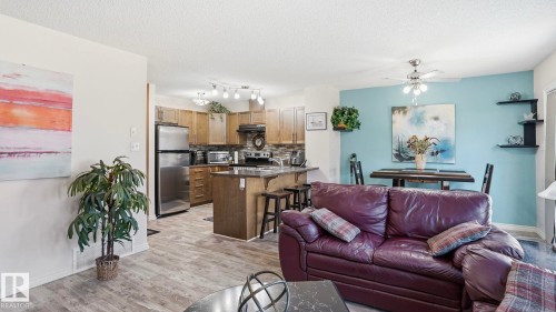 Open-concept living space featuring wood-finish flooring - 1709 64 Street, Edmonton, AB - Indoor