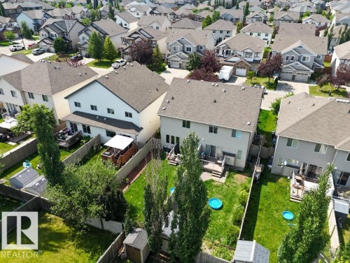 Aerial perspective showcasing multiple properties within a residential neighborhood - 1709 64 Street Sw, Edmonton, AB - Outdoor