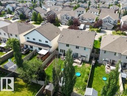 Aerial perspective showcasing multiple properties within a residential neighborhood - 