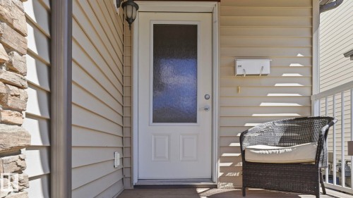 Entry door with integrated frosted glass panel - 1709 64 Street, Edmonton, AB - Outdoor With Exterior