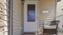 Entry door with integrated frosted glass panel - 1709 64 Street, Edmonton, AB  - Outdoor With Exterior 