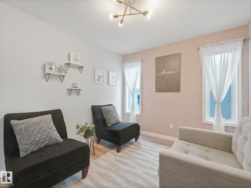 71 Rue Bouchard, Beaumont, AB - Indoor Photo Showing Living Room