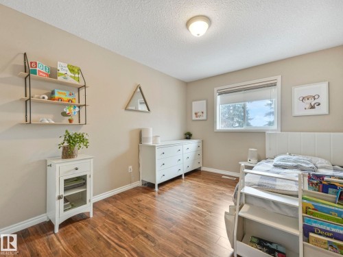 71 Rue Bouchard, Beaumont, AB - Indoor Photo Showing Bedroom