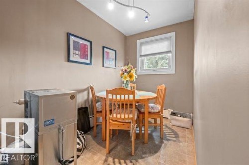 Dining area featuring tiled flooring, a window with blinds, and recessed lighting - 10616 136 Street, Edmonton, AB - Indoor Photo Showing Dining Room