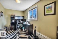 Room featuring a single window with white trim, light-toned walls, and ceiling-mounted lighting - 