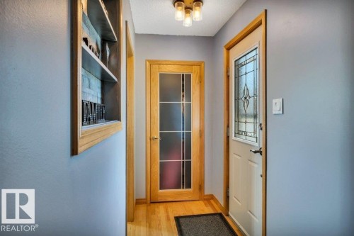 Entryway featuring wood-finish flooring and light gray wall paint - 10616 136 Street, Edmonton, AB - Indoor Photo Showing Other Room