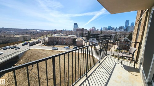 Private balcony featuring a black metal railing and concrete flooring - 603 9028 Jasper Avenue, Edmonton, AB - Outdoor With View With Exterior