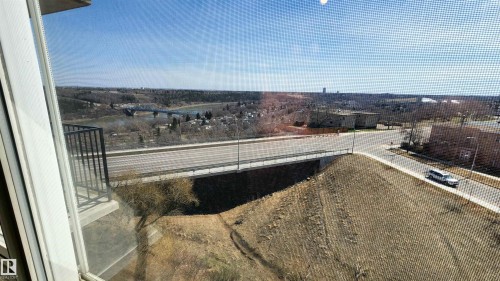View From PRIMARY Bedroom! Expansive outdoor panorama featuring a river, bridge, and distant cityscape - 603 9028 Jasper Avenue, Edmonton, AB -  With View
