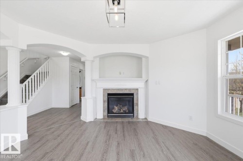 301 Avena Link, Leduc, AB - Indoor Photo Showing Living Room With Fireplace