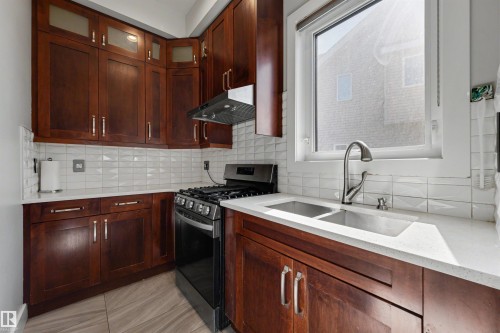 9055 24 Avenue, Edmonton, AB - Indoor Photo Showing Kitchen With Double Sink