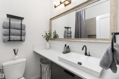 Contemporary bathroom featuring a rectangular vessel sink with a matte black faucet - 38 Woodcrest Avenue, St. Albert, AB - Indoor Photo Showing Bathroom