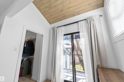 Room featuring a wood-finish vaulted ceiling, white walls, and wood-finish flooring - 38 Woodcrest Avenue, St. Albert, AB - Indoor Photo Showing Other Room