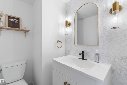 Vanity with integrated sink, matte black faucet, and white countertop - 38 Woodcrest Avenue, St. Albert, AB - Indoor Photo Showing Bathroom