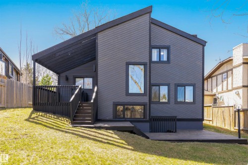 Contemporary exterior featuring dark siding and varied window placements - 38 Woodcrest Avenue, St. Albert, AB - Outdoor