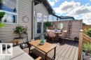 Expansive multi-level deck featuring composite decking, wood privacy screen, and direct access to the interior - 4343 Mcmullen Way, Edmonton, AB  - Outdoor With Deck Patio Veranda With Exterior 
