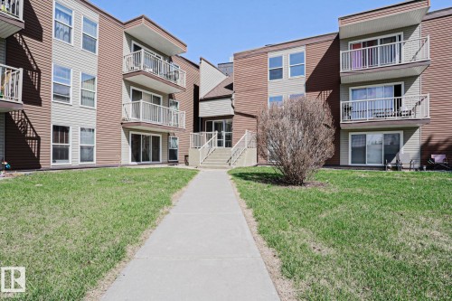 Multi-story building featuring brown and beige horizontal siding - 118 7220 144 Avenue, Edmonton, AB - Outdoor