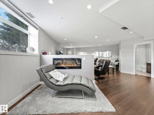 122 5151 Windermere Boulevard, Edmonton, AB - Indoor With Fireplace
