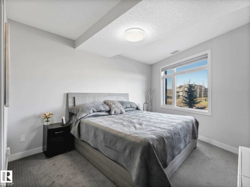 122 5151 Windermere Boulevard, Edmonton, AB - Indoor Photo Showing Bedroom