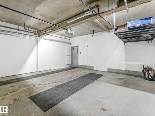 122 5151 Windermere Boulevard, Edmonton, AB - Indoor Photo Showing Garage