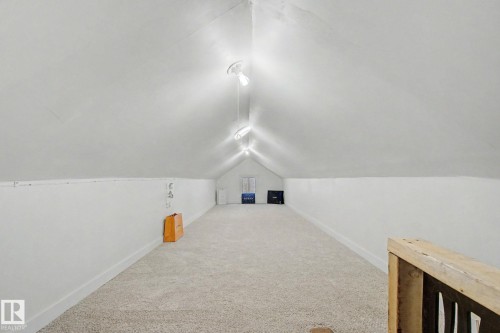 Carpeted attic space with sloped ceilings - 11512 122 St, Edmonton, AB - Indoor Photo Showing Other Room