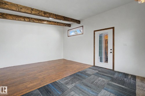 Exposed wood beams accenting the ceiling - 11512 122 St, Edmonton, AB - Indoor Photo Showing Other Room