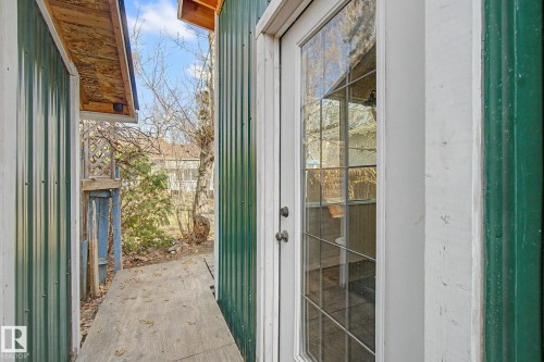 Glass-paned exterior door with white trim - 11512 122 St, Edmonton, AB -  With Exterior