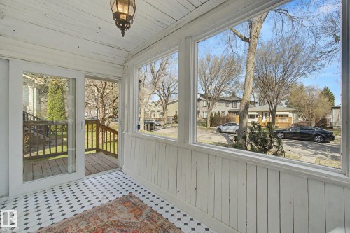 Enclosed porch featuring black and white patterned floor tiles, white shiplap walls, and a white shiplap ceiling - 11512 122 St, Edmonton, AB -  Photo Showing Other Room