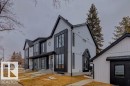 Contemporary architectural style featuring white vertical siding and black trim accents - 14816 93 Avenue, Edmonton, AB  - Outdoor 