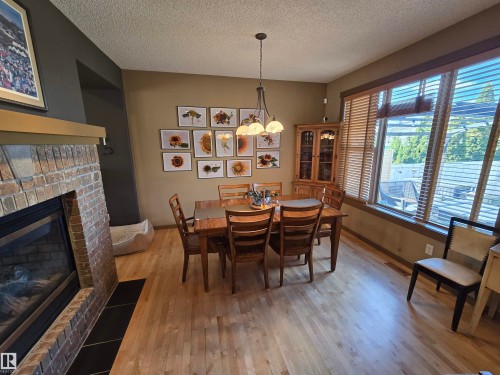 1205 Colonel Stone Avenue, Edmonton, AB - Indoor Photo Showing Dining Room With Fireplace