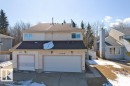 The property features a two-story exterior with a two-car garage, a paved driveway, and a shingled roof - 17313 60 Avenue, Edmonton, AB  - Outdoor With Facade 