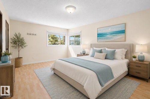 Light wood-finish flooring complements the neutral wall tones - 17313 60 Avenue, Edmonton, AB - Indoor Photo Showing Bedroom