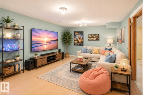 Spacious entertainment room featuring light wood-finish flooring, a contemporary ceiling, and recessed lighting - 17313 60 Avenue, Edmonton, AB - Indoor Photo Showing Living Room