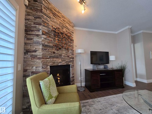 108 11650 79 Avenue, Edmonton, AB - Indoor Photo Showing Living Room With Fireplace