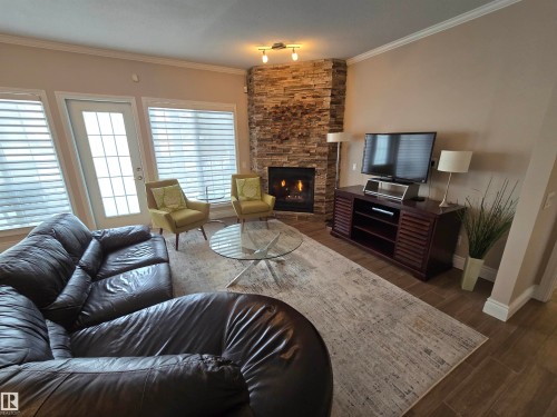 108 11650 79 Avenue, Edmonton, AB - Indoor Photo Showing Living Room With Fireplace