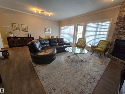 108 11650 79 Avenue, Edmonton, AB - Indoor Photo Showing Living Room With Fireplace