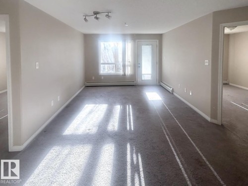Neutral-toned walls complement the gray carpeting - 6120 7331 South Terwillegar Drive Nw, Edmonton, AB - Indoor Photo Showing Other Room