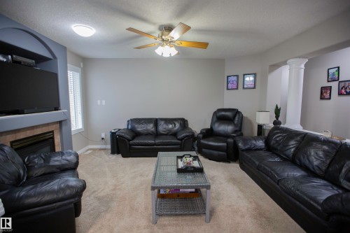 2817 40A Avenue, Edmonton, AB - Indoor Photo Showing Living Room With Fireplace