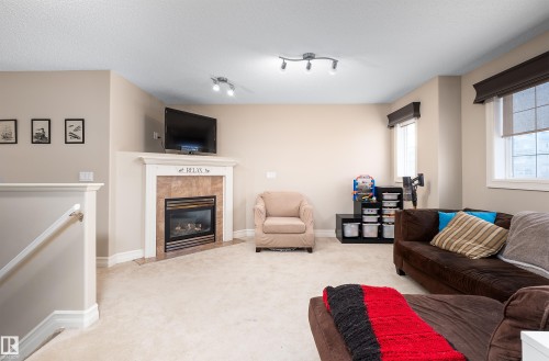 4 Spring Grove Crescent, Spruce Grove, AB - Indoor Photo Showing Living Room With Fireplace