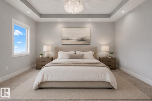 Bedroom featuring a tray ceiling with recessed lighting and a central chandelier. Virtually Staged. - 635 42 Street, Edmonton, AB - Indoor Photo Showing Bedroom