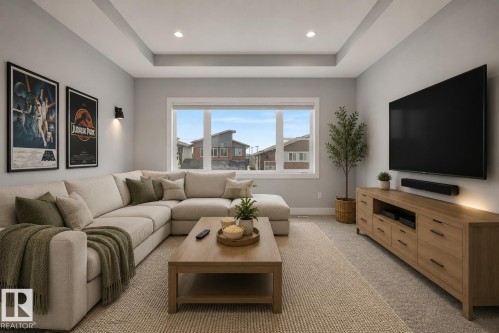 Living space featuring a tray ceiling with recessed lighting, a large window, wall-mounted lighting, and carpeted flooring. Virtually Staged. - 635 42 Street, Edmonton, AB - Indoor Photo Showing Living Room