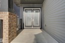 Inviting front entry featuring double doors with frosted glass panels - 635 42 Street, Edmonton, AB  - Outdoor With Exterior 