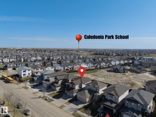 Aerial view of a residential neighborhood featuring numerous detached homes with varied architectural styles - 151 Caledonia Drive, Leduc, AB - Outdoor With View