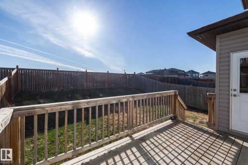 Wood deck with integrated railing - 151 Caledonia Drive, Leduc, AB - Outdoor With Exterior