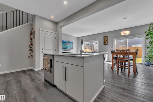Kitchen island with integrated sink and chrome faucet - 319 36 Avenue, Edmonton, AB - Indoor