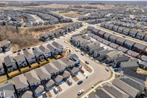 Aerial perspective of a developed residential area featuring a curvilinear street layout and uniform property sizes - 319 36 Avenue, Edmonton, AB - Outdoor With View