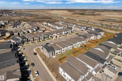 Aerial perspective of a residential community featuring a mix of detached and attached homes - 319 36 Avenue, Edmonton, AB - Outdoor With View