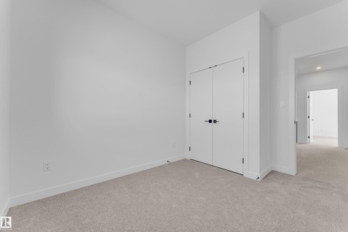 Neutral color palette with light-toned carpeting and crisp white walls - 173 Graybriar Drive, Stony Plain, AB - Indoor Photo Showing Other Room
