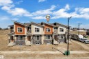 Modern townhome exteriors featuring multiple material finishes, sloped rooflines, and individual front porches - 173 Graybriar Drive, Stony Plain, AB  - Outdoor With Facade 