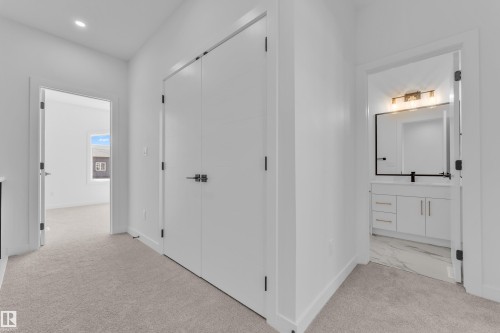 Hallway featuring light-toned carpeting, white walls, and recessed lighting - 173 Graybriar Drive, Stony Plain, AB - Indoor Photo Showing Other Room